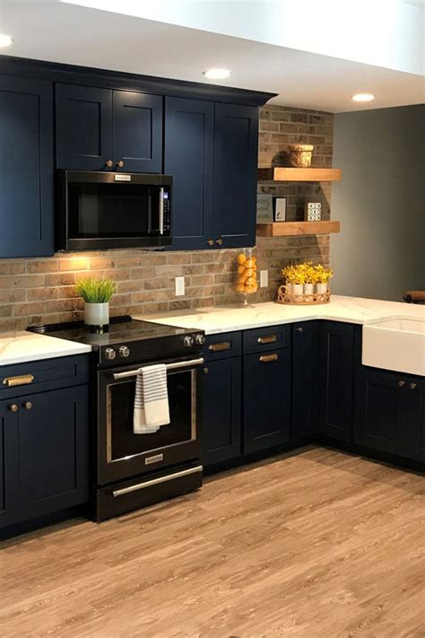 blue cabinets with black stainless steel appliances|white kitchen cabinets blue backsplash.